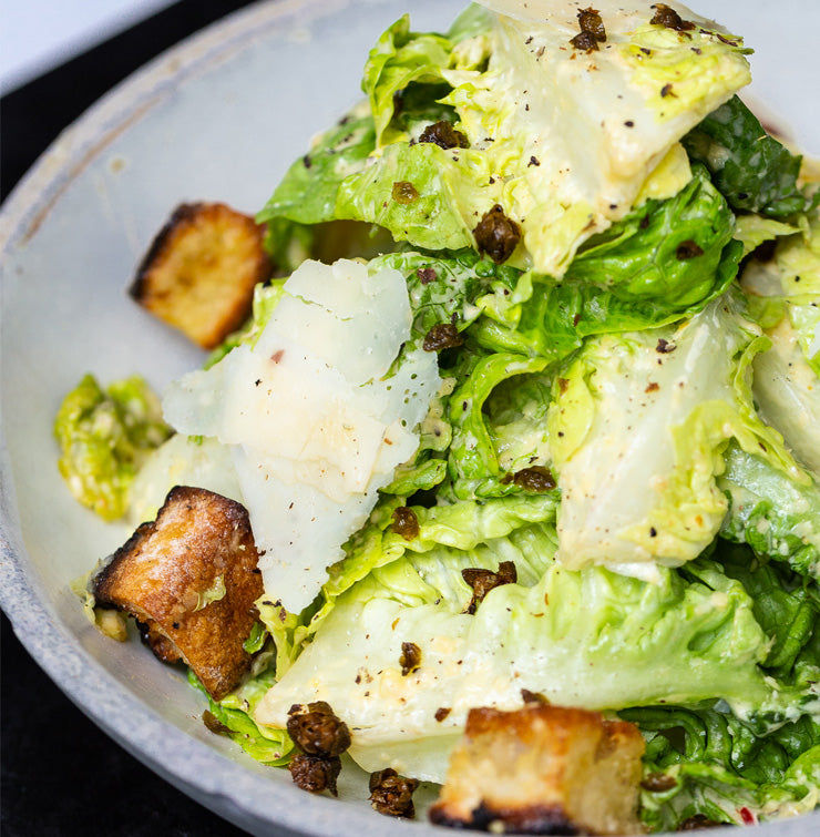 Cesare salad with little gem and pizza dough croutons