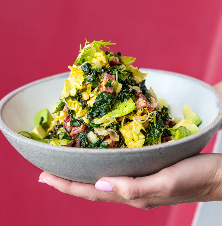 Chop salad with greens, salami, olive and chickpea