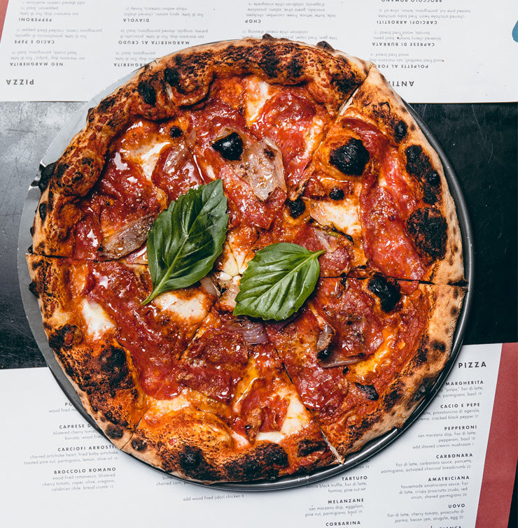 Diavola pizza with salami, fior di latte, shallot, honey and basil