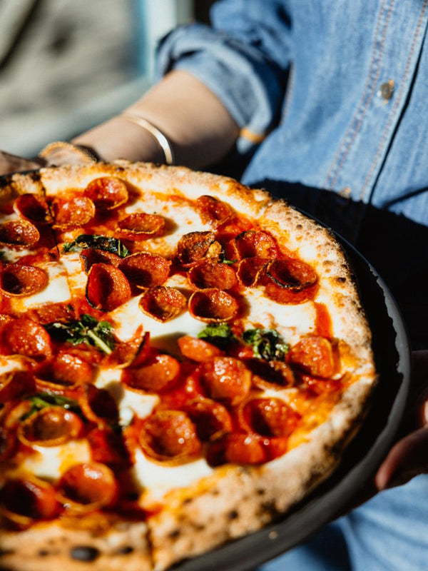 Pepperoni pizza with basil and fior di latte