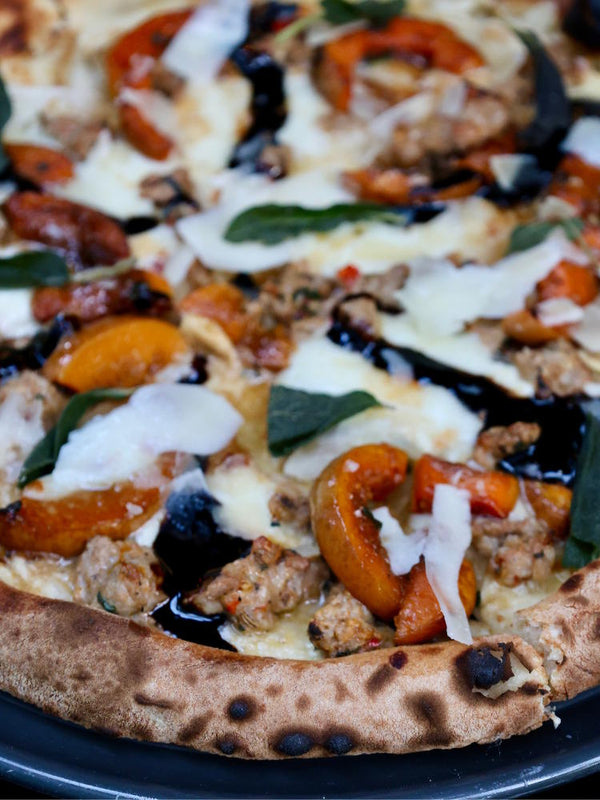 Zucca Thanksgiving pizza with honeynut squash and turkey sausage.