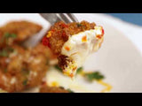 Video of fork with crispy cauliflower being dipped into calabrian lemon aioli