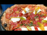 Video of Corbarina pizza spinning and hand taking a slice