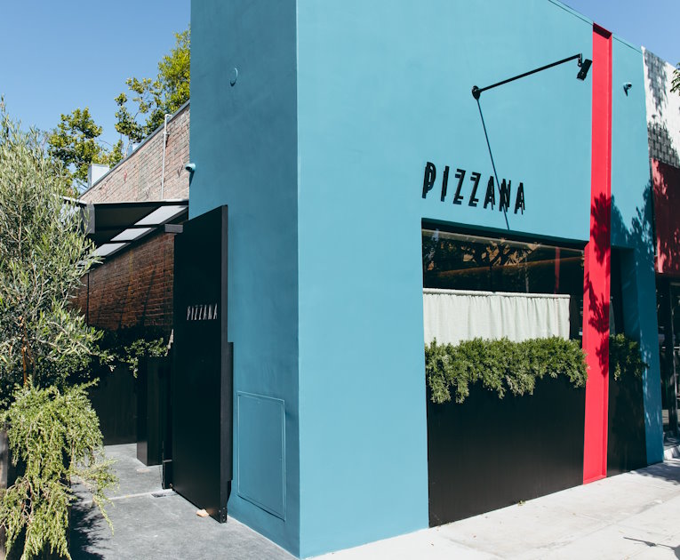 Facade of Pizzana West Hollywood with bright blue paint and a red stripe