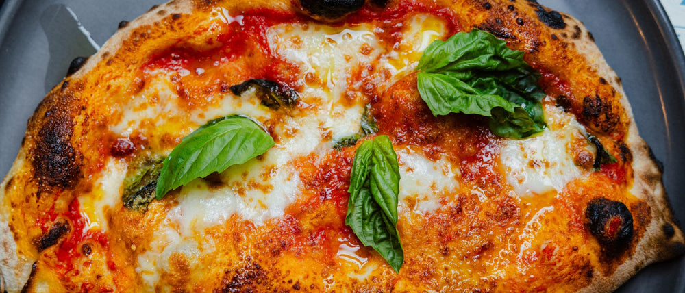 Calzone folded over pizza filled with ricotta, san marzano dop, fior di latte and black pepper