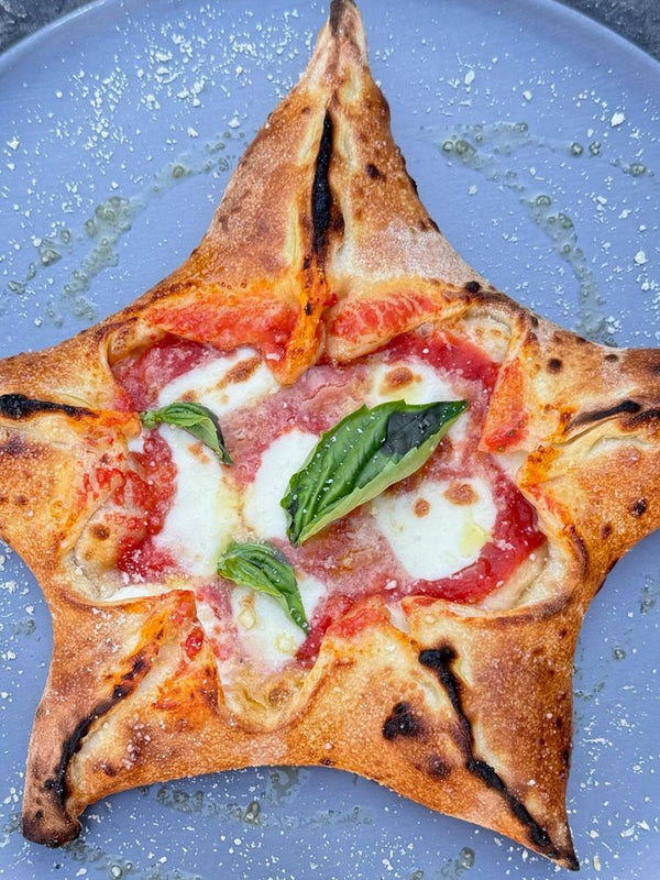 Stella pizza star shaped margherita pizza for Christmas available on Goldbelly