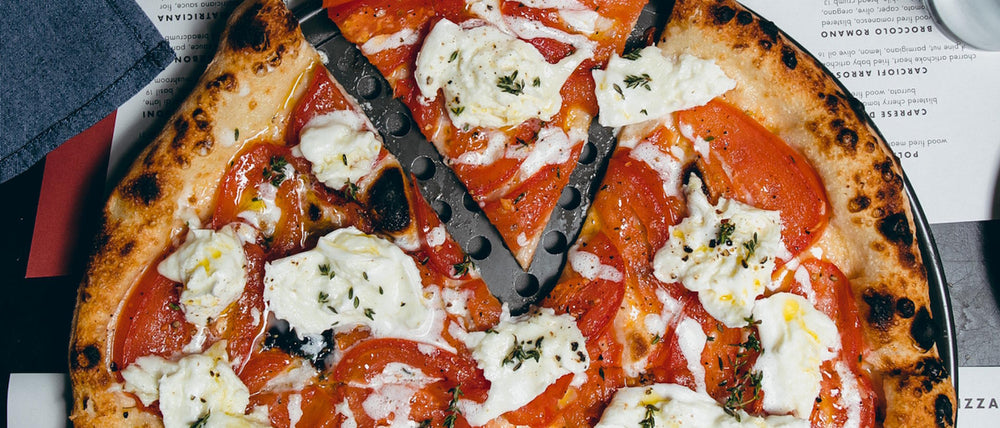 Sud a Sud pizza featuring California San Marzano tomatoes, mozzarella di bufala dop, garlic and thyme