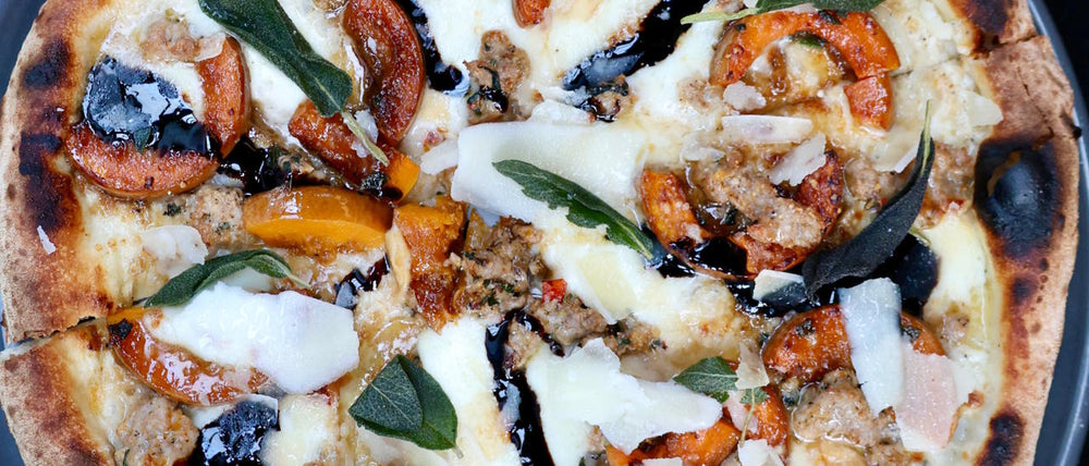Zucca Thanksgiving pizza with honeynut squash and turkey sausage.