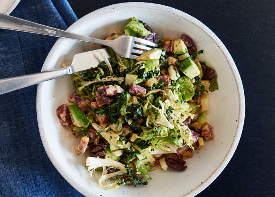 Chop salad with greens, salami, olive and chickpea