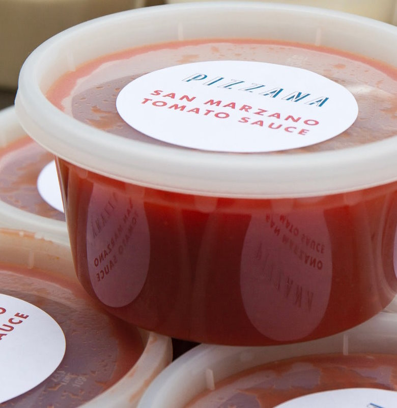 Fresh, bright red San Marzano tomato sauce in a to go container