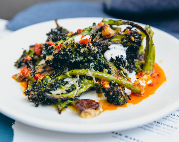Wood fired Broccolini antipasto with whipped ricotta and calabrian chile oil