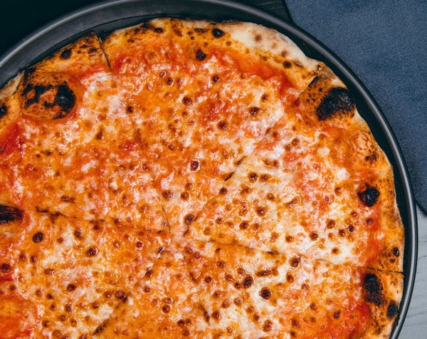 Closeup view of Classic Cheese pizza with melted cheese and san marzano dop