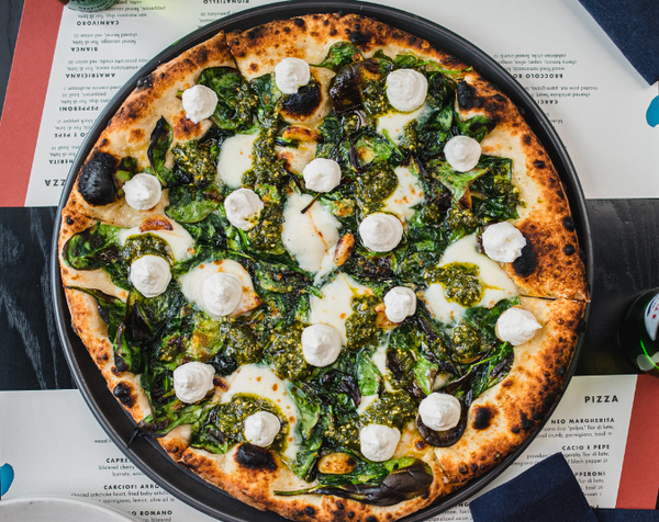 Spinaci pizza with spinach, basil pesto and parmigiano crema